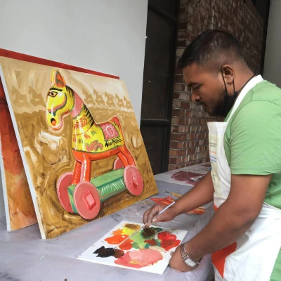 Azmol Hosen painting a bengali folk horse